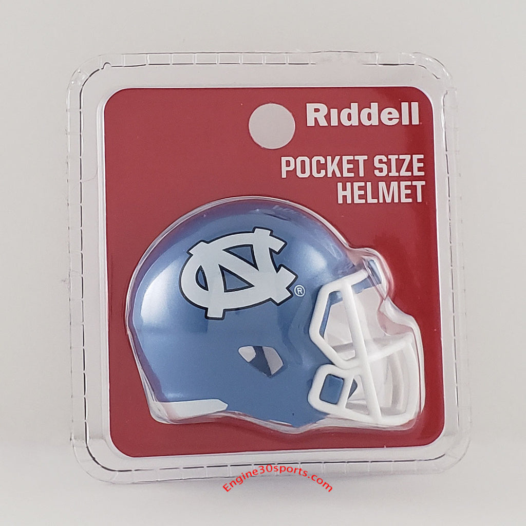 Riddell pocket size helmet in its original blister packaging, featuring a miniature blue and white UNC Tar Heels football helmet.