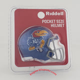 Riddell pocket size helmet featuring the Kansas Jayhawks logo, in its original blister pack packaging with a red backing card.